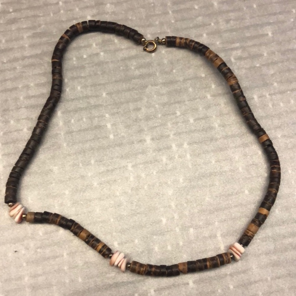 Brown wooden necklace with pooka shells